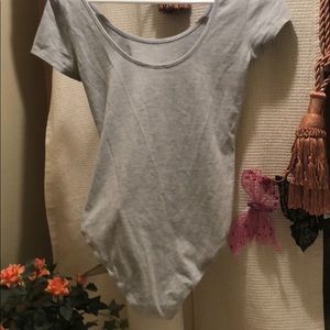 Timing on piece shirt. Snap bottom